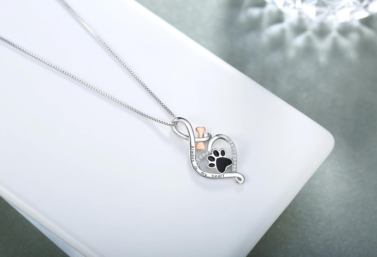 Gelukspootketting met hart-, bot- en oneindigheidssymbool
