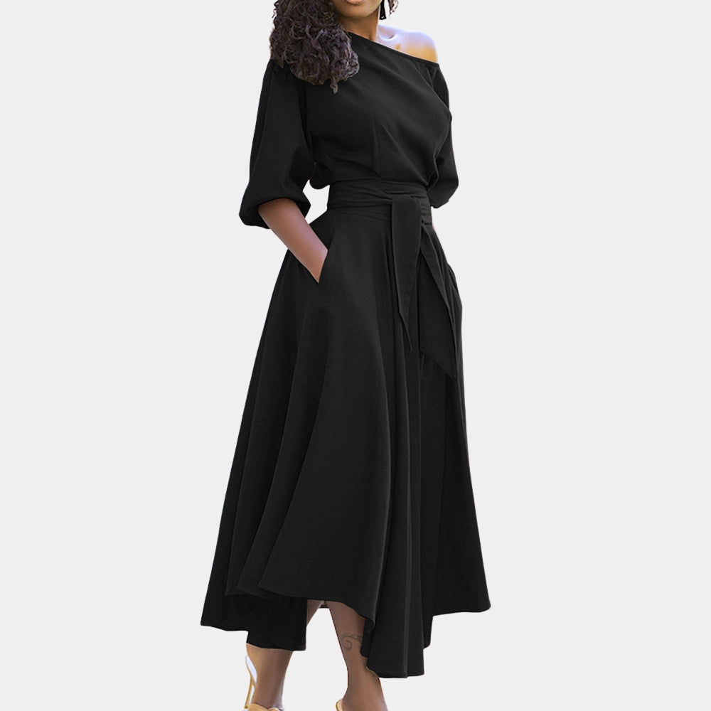 Black plus-size midi wrap dress featuring an asymmetrical neckline and batwing sleeves.