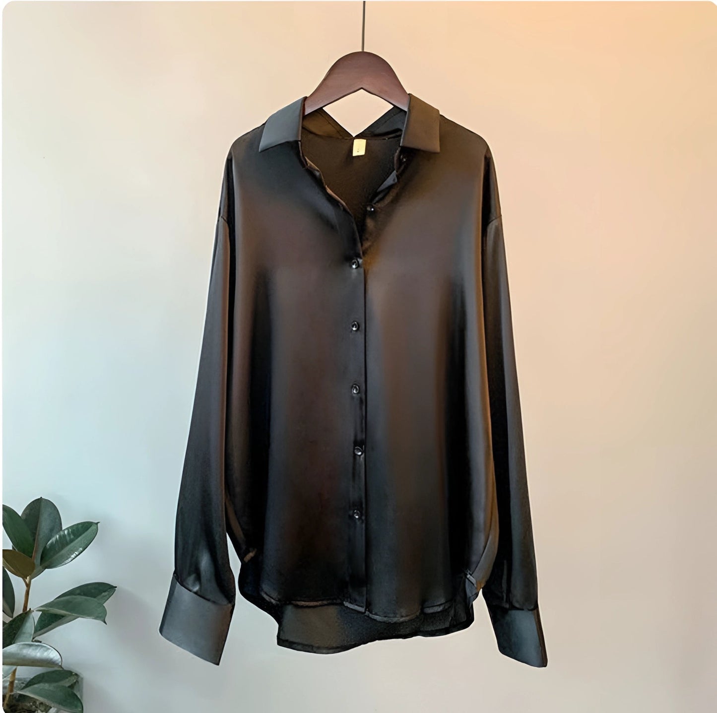 Elegant black silk blouse with a luxurious satin finish, featuring a button-up design. The blouse has long sleeves and a classic collar, available in size 3XL.