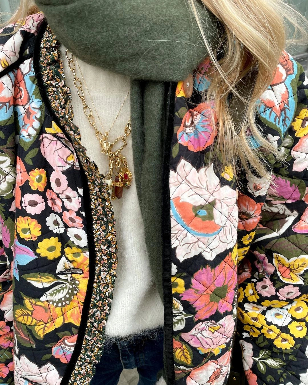 Women's trendy multicolor floral puffer jacket with a stylish collar and long sleeves, designed for winter outerwear.