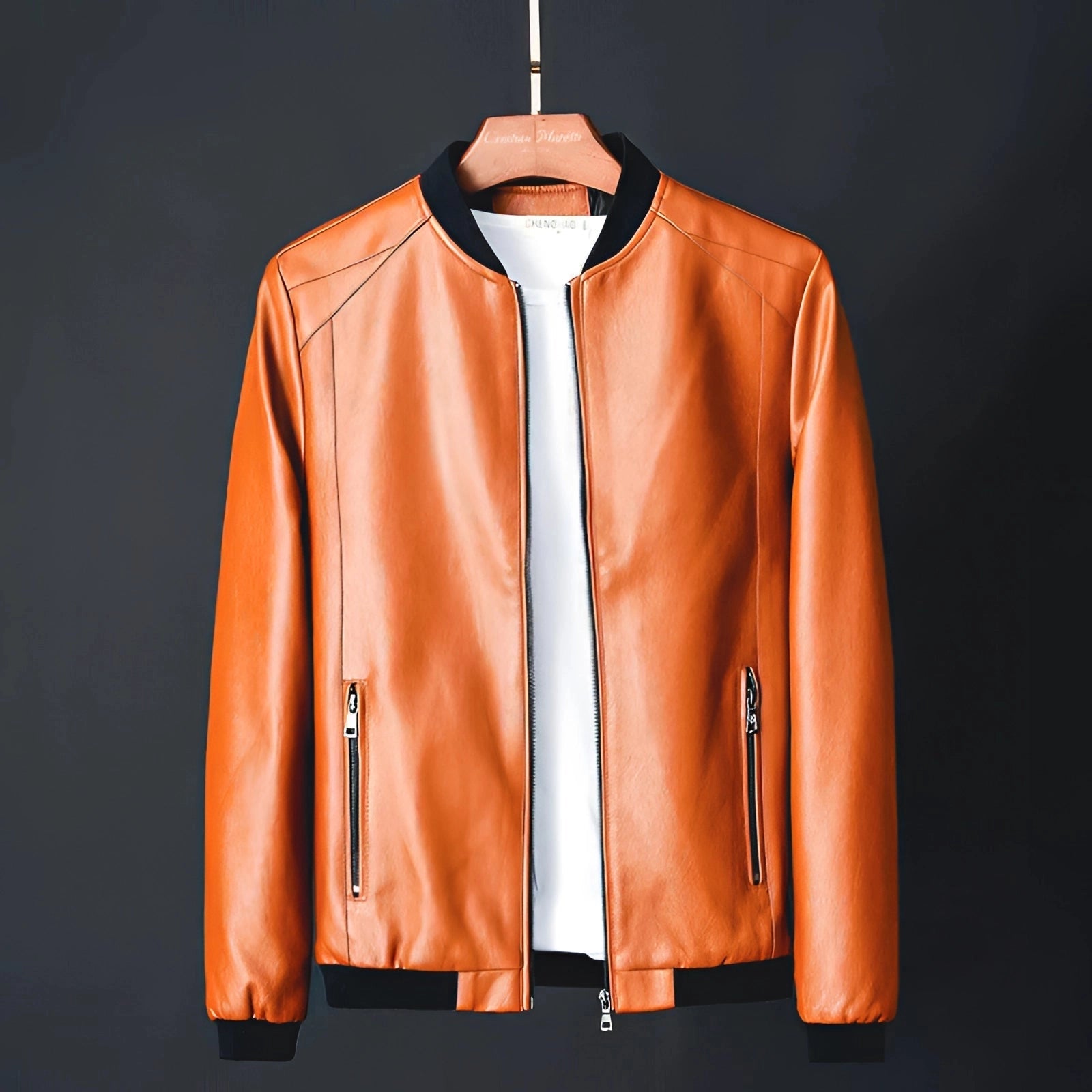 Men's classic black glossy leather jacket with a sleek design, showcased here in the Marrone11 variant. The jacket is displayed on a clothes hanger, highlighting its luxurious outerwear style with a tailored collar, structured neck, and long sleeves. The design embodies a fashion-forward aesthetic, suitable for 5XL size.