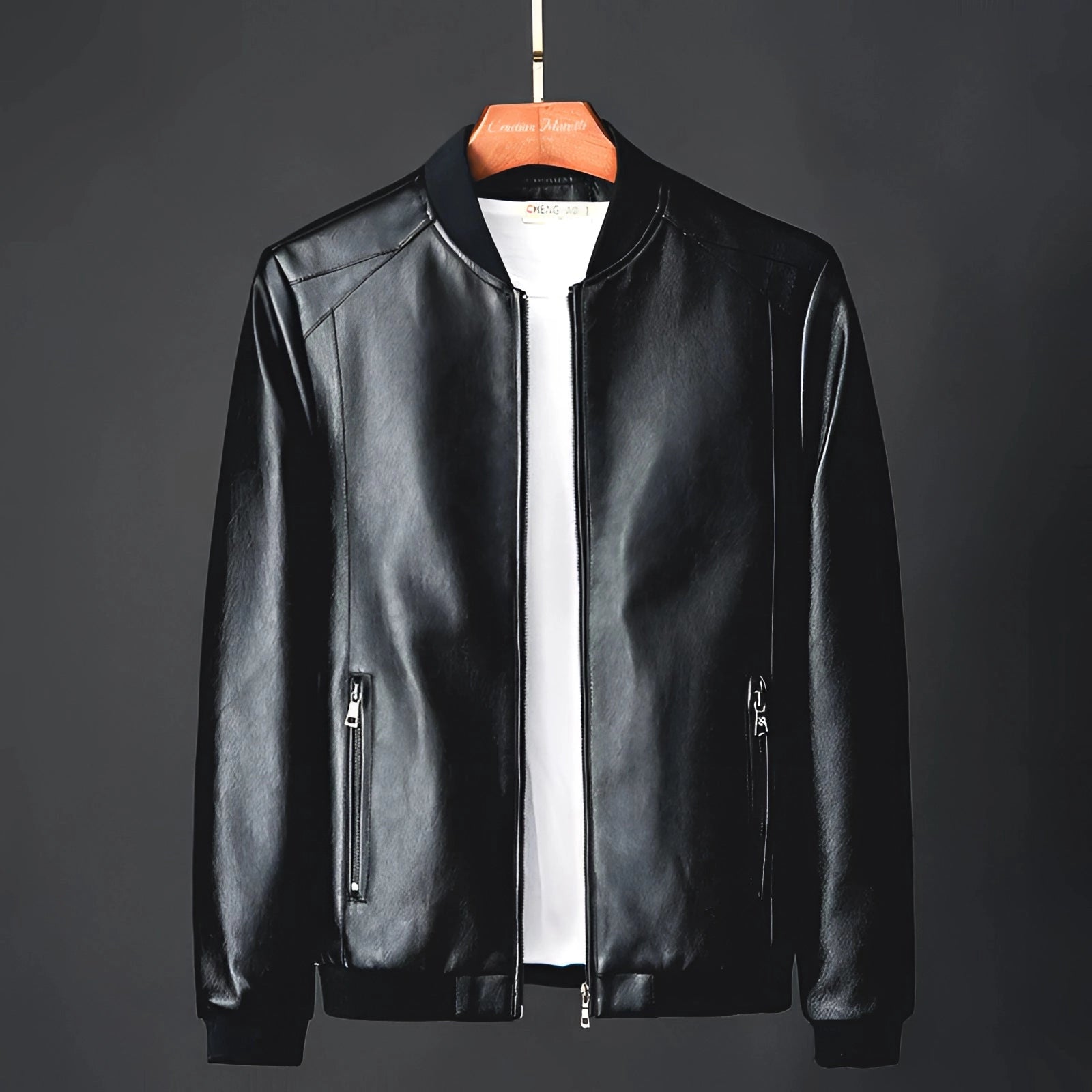 Men's classic black glossy leather jacket featuring a luxurious outerwear design with a structured collar, long sleeves, and button-up front, styled as a sophisticated and versatile piece perfect for formal or casual settings.