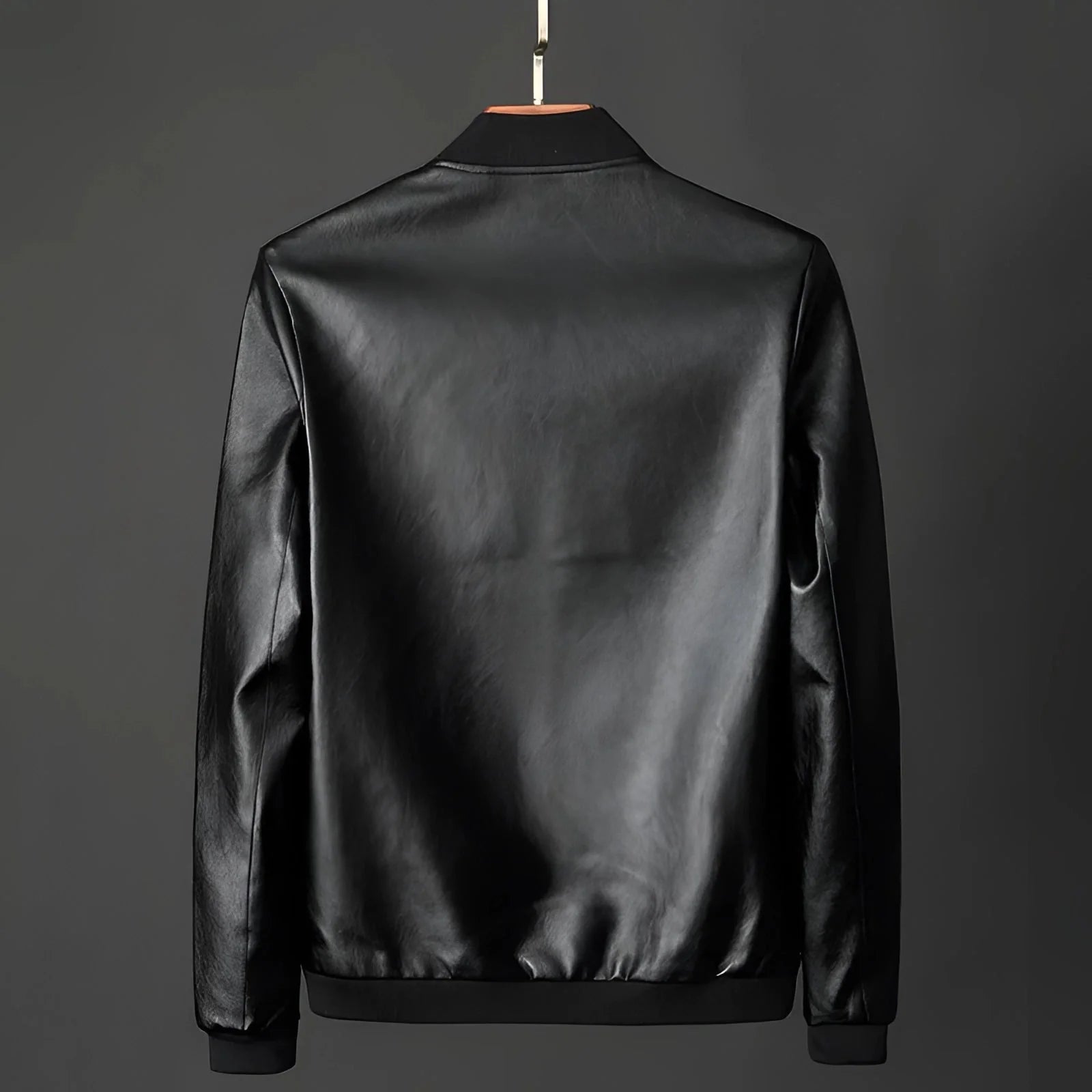 Men's classic black glossy leather jacket displayed on a clothes hanger, featuring a sleek design with a collar and long sleeves, ideal for luxury outerwear and formal wear occasions.