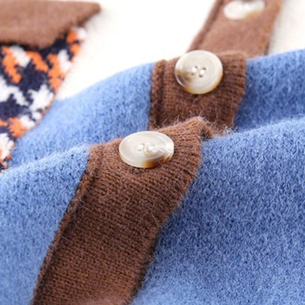 Oversized women's cardigan with a geometric color block pattern featuring shades of brown, azure, grey, beige, and electric blue. The knitwear includes long sleeves and a collar, suitable for autumn wear.