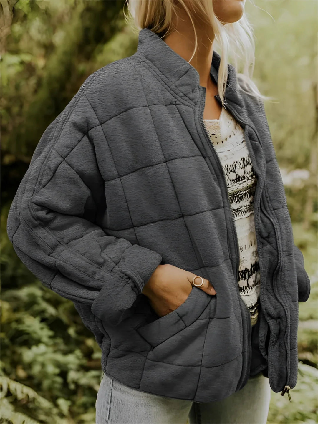 
A dark gray women's lightweight insulated quilted jacket in 2XL size, featuring a collar, long sleeves, and a fitted waist.