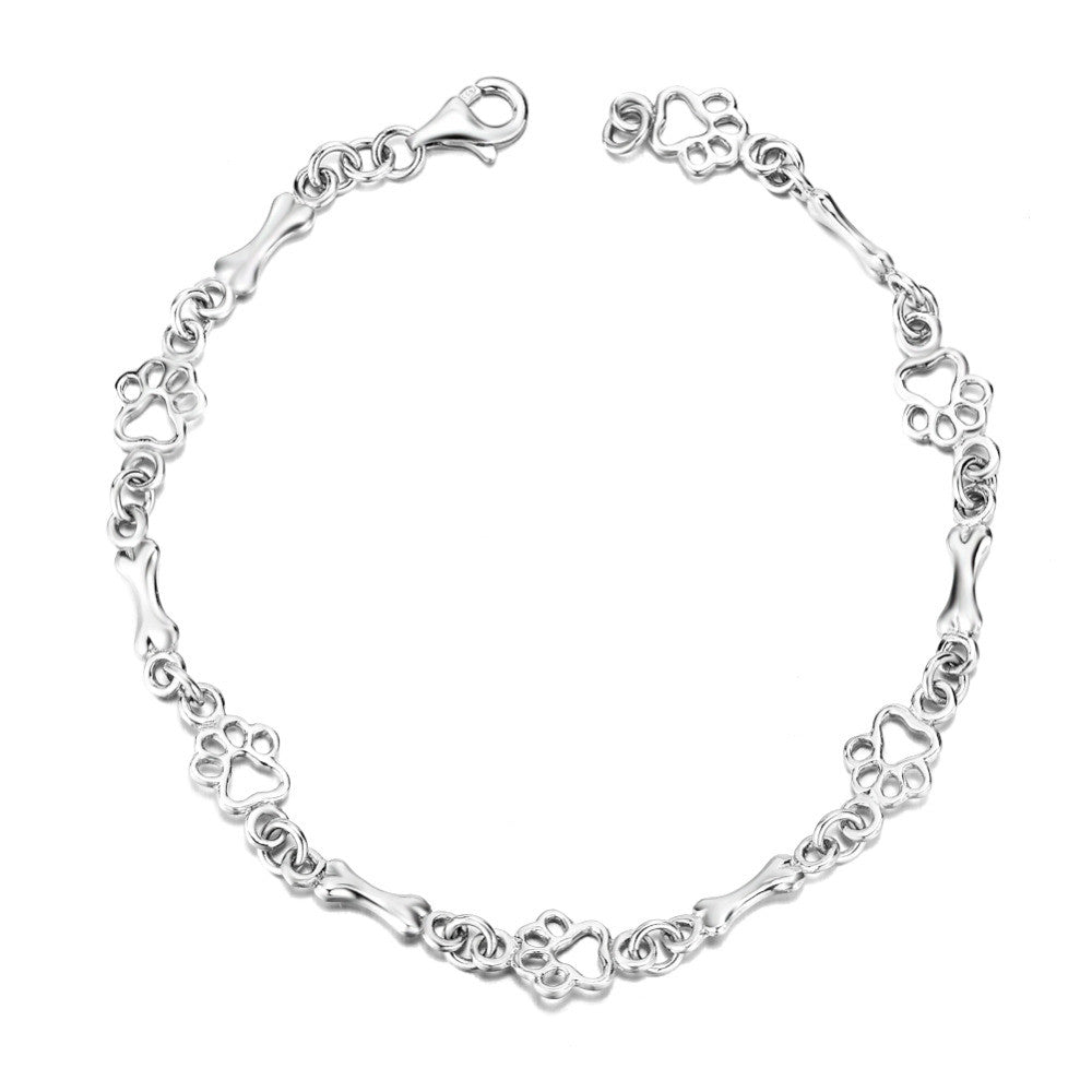 Zilveren armband met hondenpoot- en botbedeltje